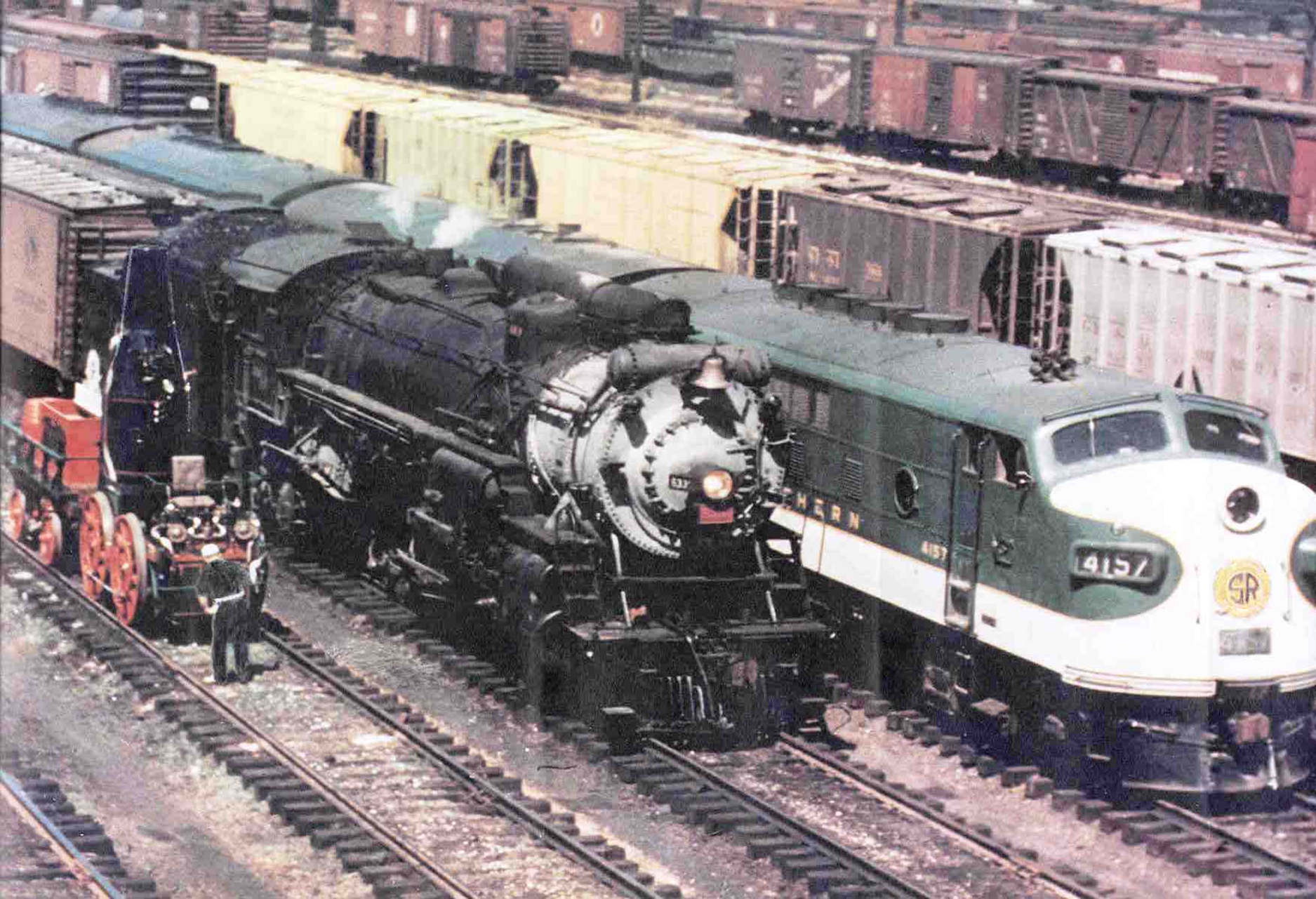 In the center is steam engine #6330, flanked by the Best Friend of Charleston and Southern F-3 (later designated as an F-7) #4157.)
