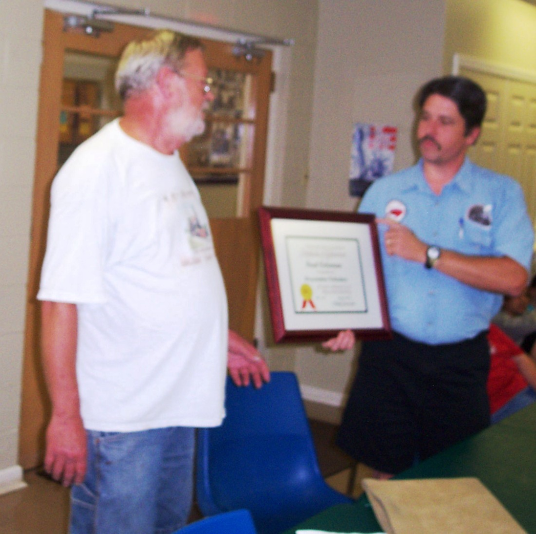 Superintendent Fred Coleman 
       received his first AP certificate from Asst. Superintendent Robert Bell