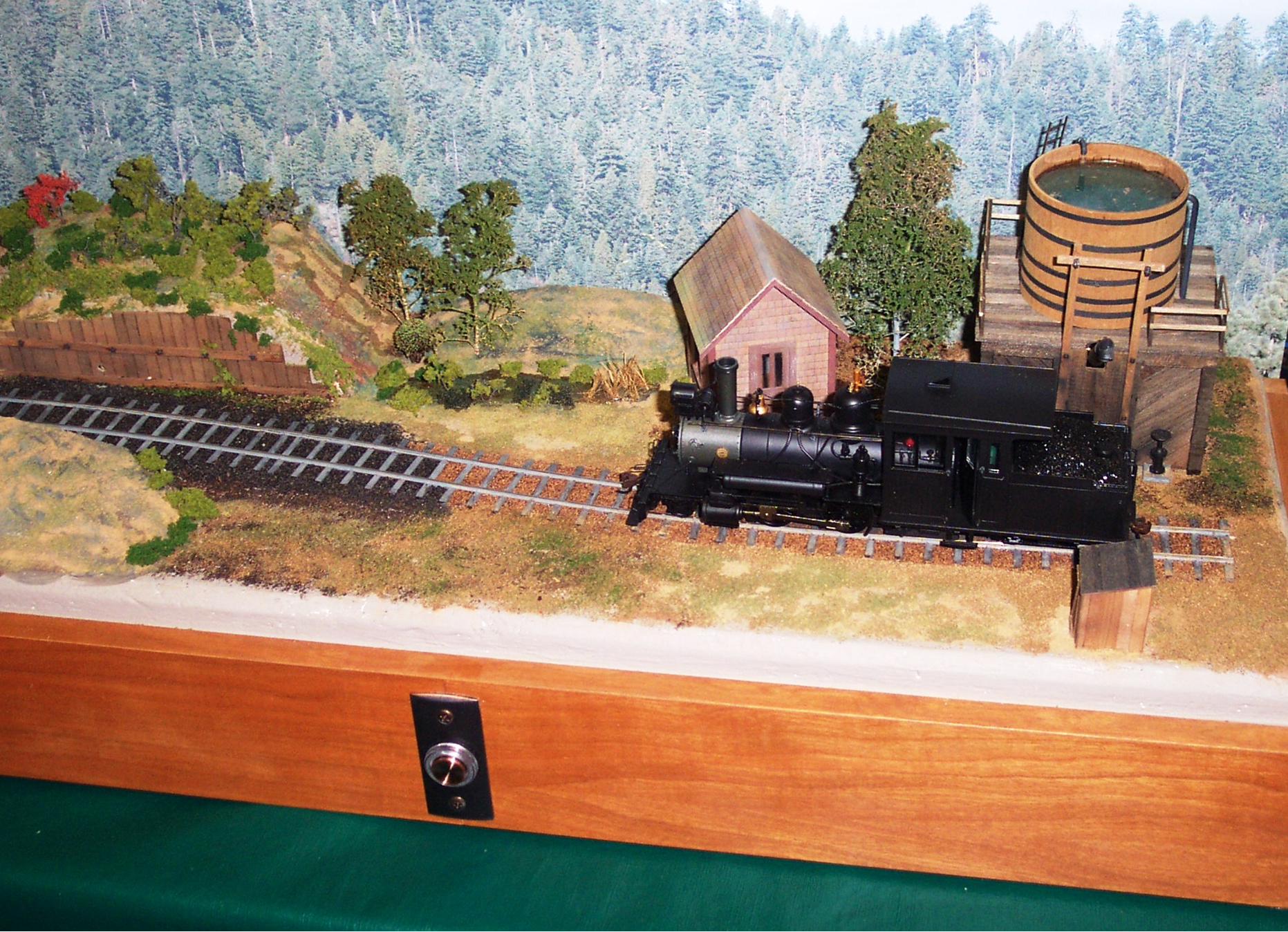 Joe Norris presented our program. Here is a view of his diorama with the steam engine taking on water.