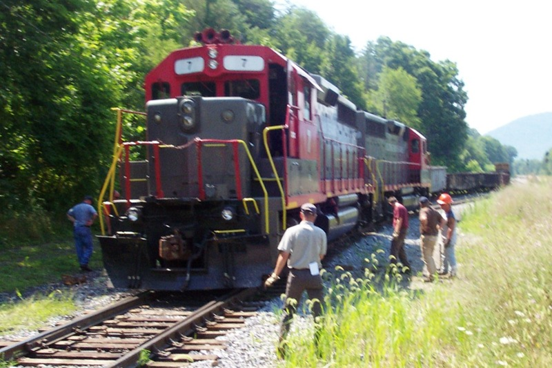 Men looking at diesel engine